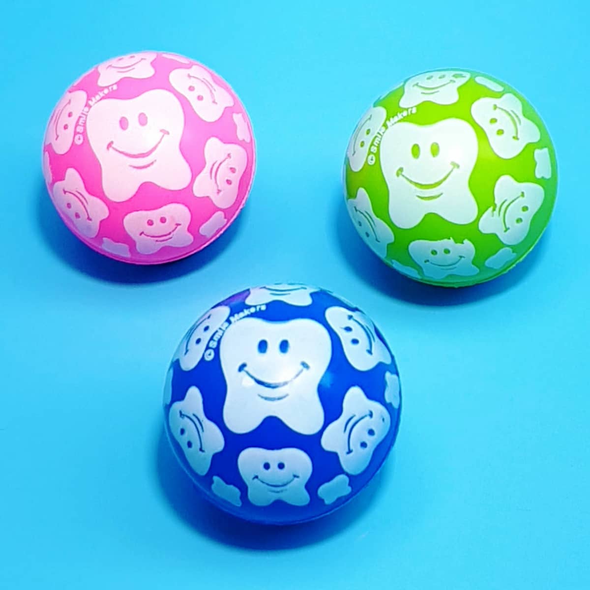 bunte Flummis mit Zahnmotiv